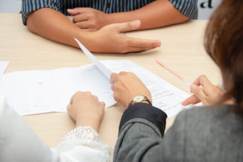 woman handling paperwork